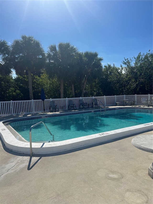 view of swimming pool with a patio