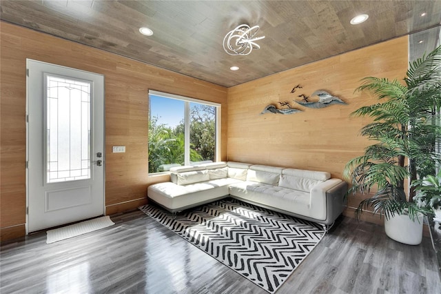 living room featuring wood ceiling, wood-type flooring, and wood walls