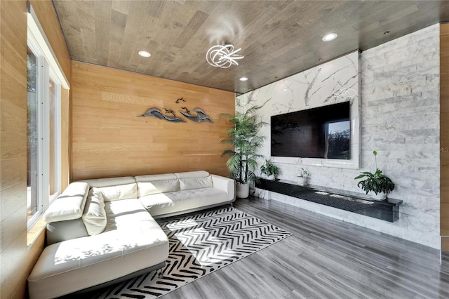 living room with hardwood / wood-style floors, wood ceiling, and wood walls