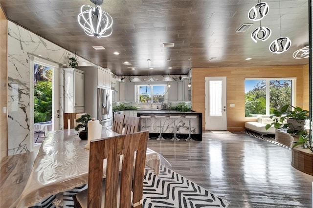 dining room featuring an inviting chandelier and hardwood / wood-style floors