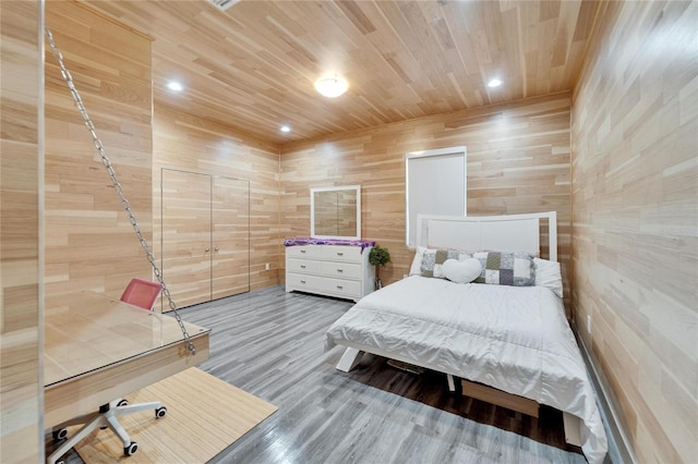 bedroom featuring wood ceiling and hardwood / wood-style flooring