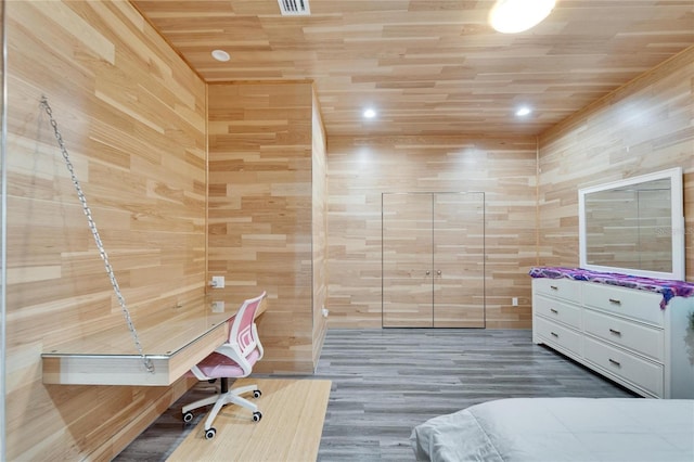 unfurnished bedroom featuring wood ceiling, wooden walls, and hardwood / wood-style flooring