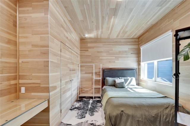 bedroom featuring wood ceiling and wooden walls