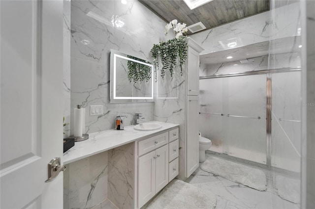 bathroom featuring vanity, an enclosed shower, and toilet