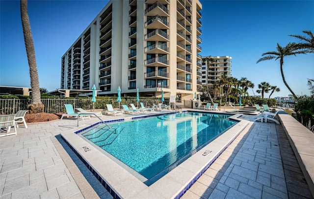 view of swimming pool featuring a patio area