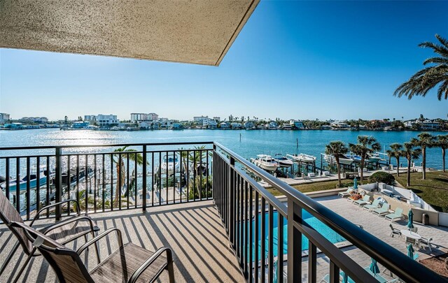 balcony featuring a water view