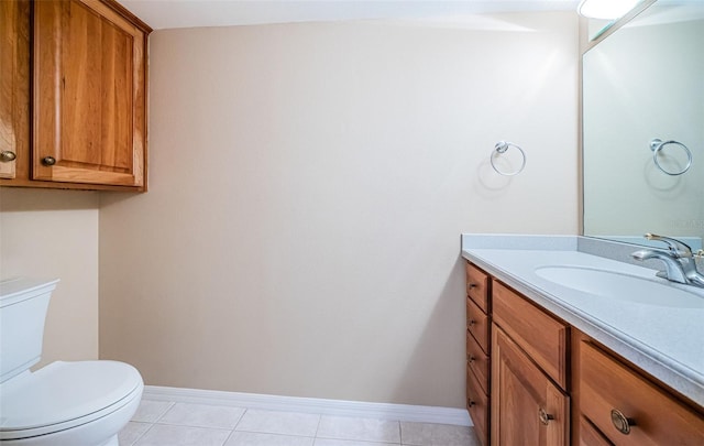 bathroom with vanity, tile patterned floors, and toilet