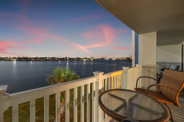 balcony at dusk with a water view