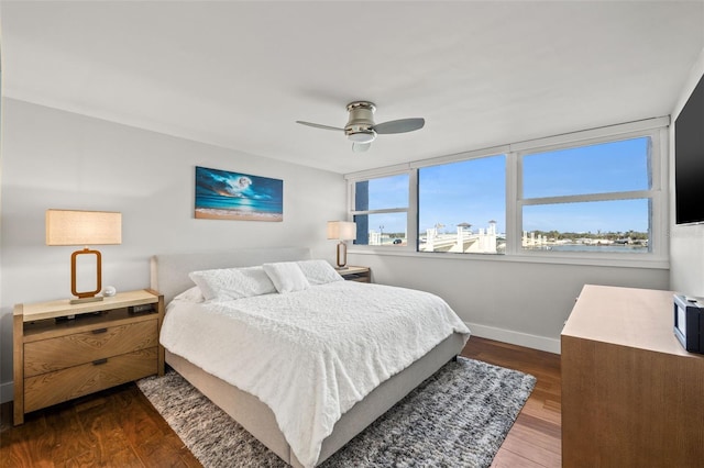 bedroom featuring ceiling fan and dark hardwood / wood-style flooring