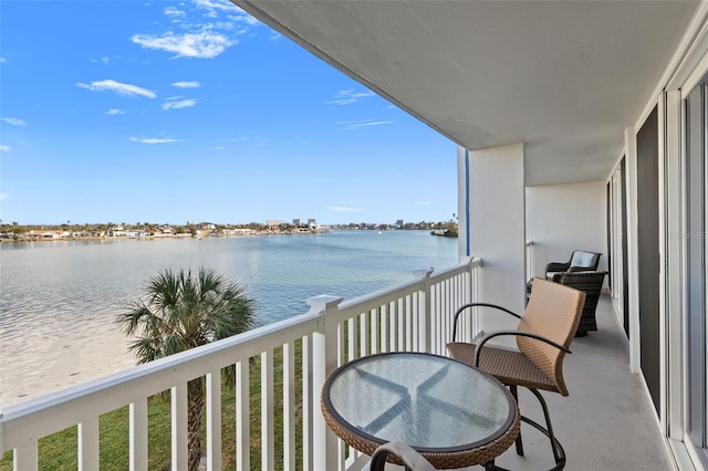 balcony featuring a water view