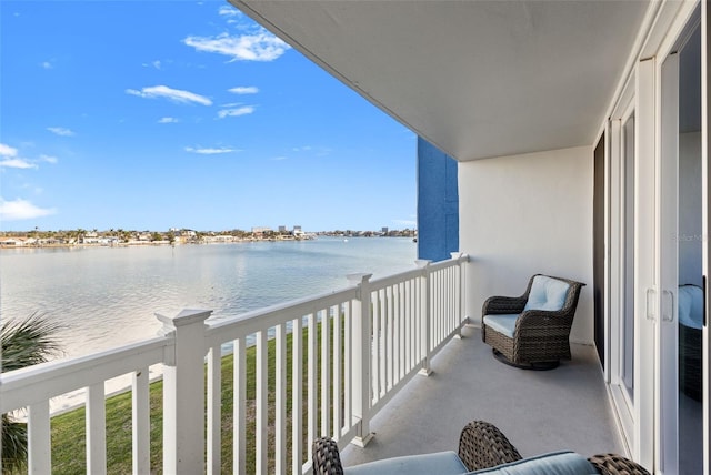 balcony featuring a water view