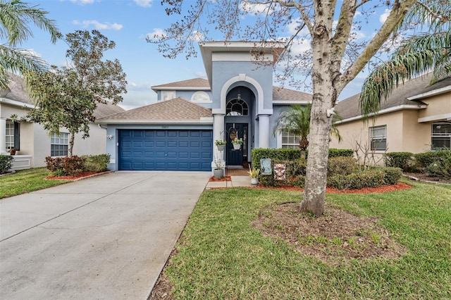 view of front of home with a garage and a front yard