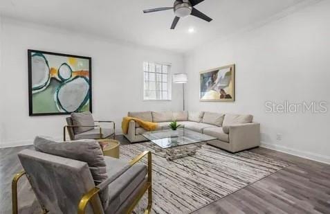 living room with ceiling fan and wood-type flooring