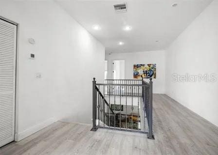 hallway with light wood-type flooring