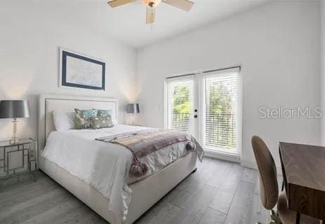 bedroom with ceiling fan, light hardwood / wood-style flooring, and access to outside