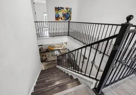 staircase featuring wood-type flooring