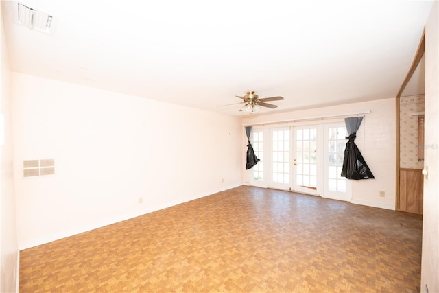 spare room featuring ceiling fan, visible vents, and french doors