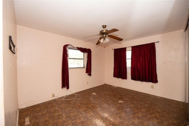 unfurnished room featuring a ceiling fan