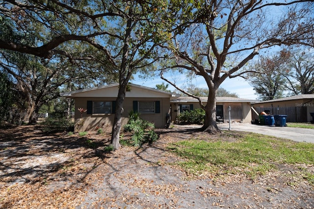 single story home featuring driveway