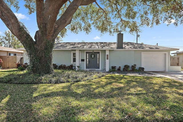 single story home with a garage and a front yard