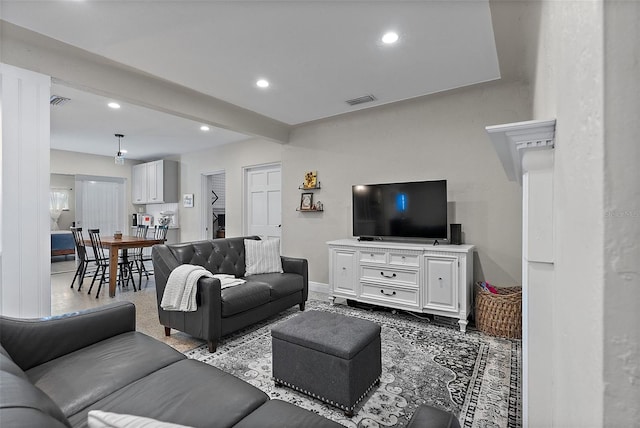 living room with beamed ceiling