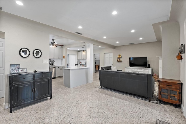 living room featuring ceiling fan