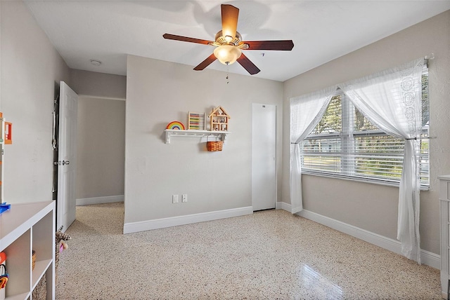 interior space featuring ceiling fan