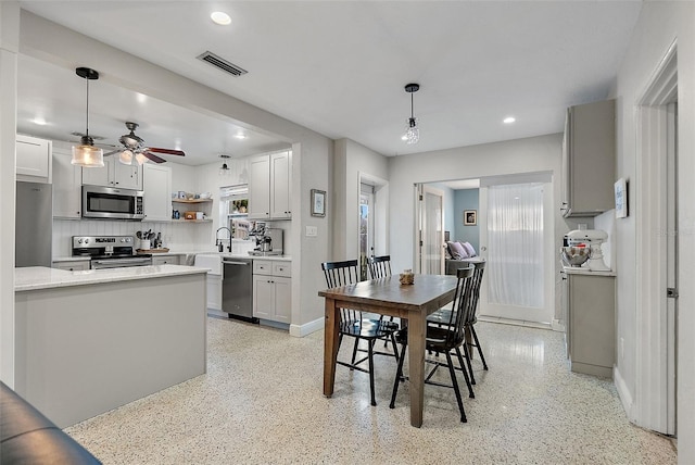 dining room featuring a healthy amount of sunlight and ceiling fan