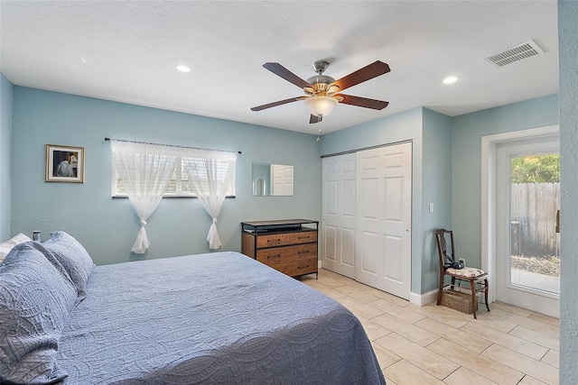 bedroom featuring ceiling fan and a closet