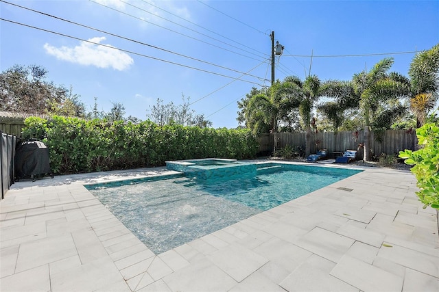 view of swimming pool featuring an in ground hot tub and a patio area