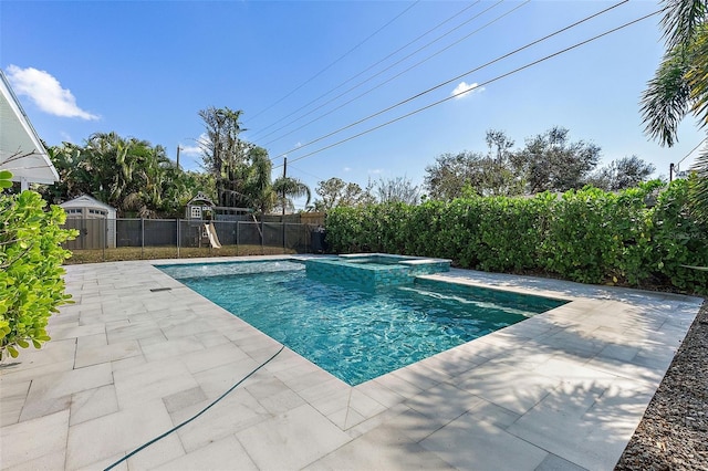 view of pool featuring a patio area and an in ground hot tub