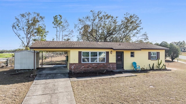 ranch-style house with a carport and a shed