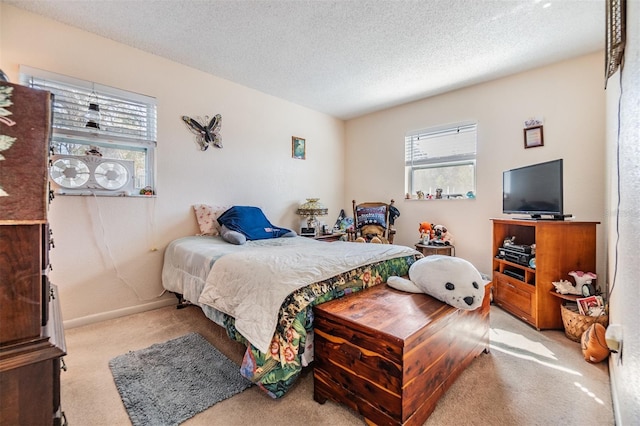 carpeted bedroom with a textured ceiling