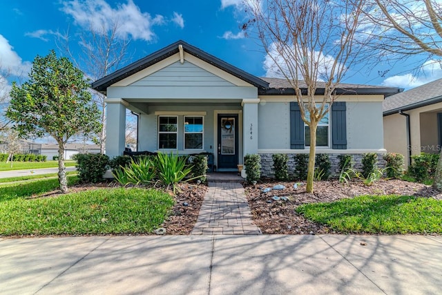 view of front of property featuring covered porch