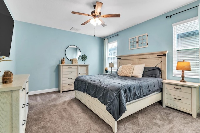 bedroom with light colored carpet and ceiling fan