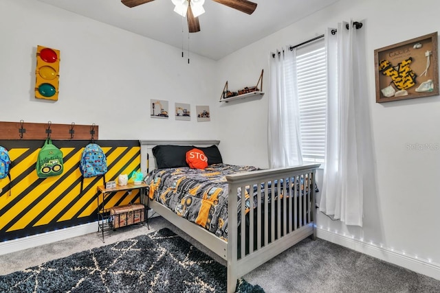 carpeted bedroom with ceiling fan