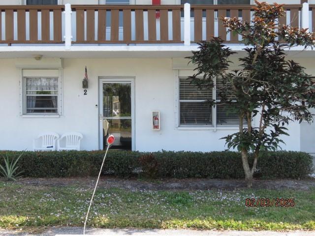 entrance to property with a balcony