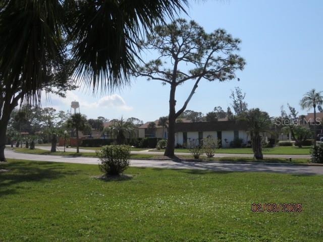 view of community featuring a yard