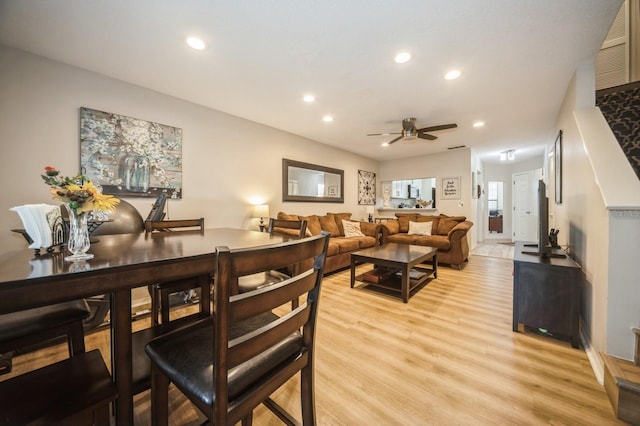 living area with light wood-style floors, ceiling fan, and recessed lighting