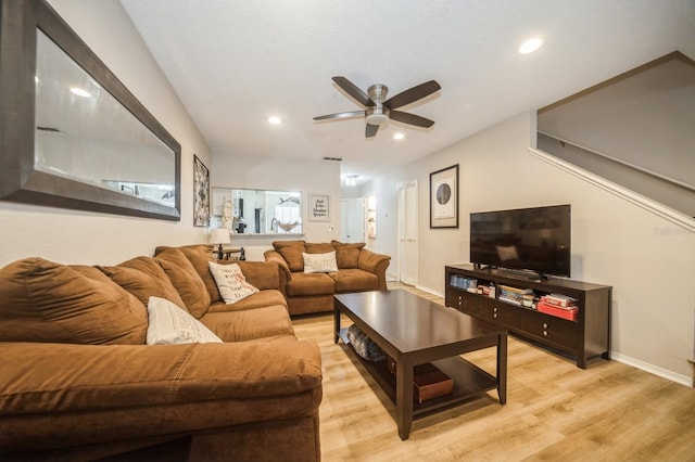 living area featuring light wood-type flooring, baseboards, a ceiling fan, and recessed lighting