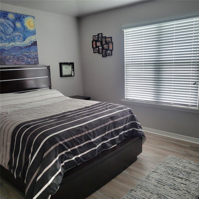 bedroom featuring hardwood / wood-style flooring