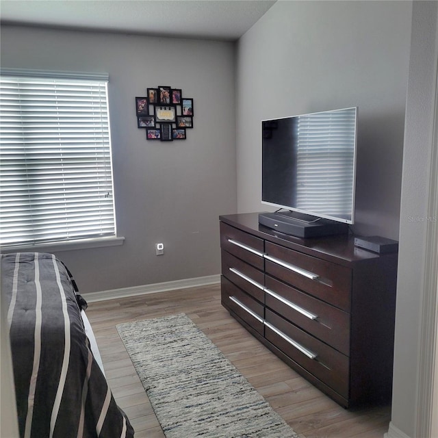 bedroom with light wood-type flooring