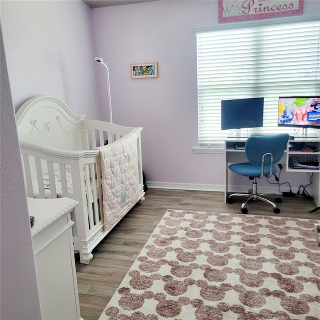 bedroom with hardwood / wood-style flooring