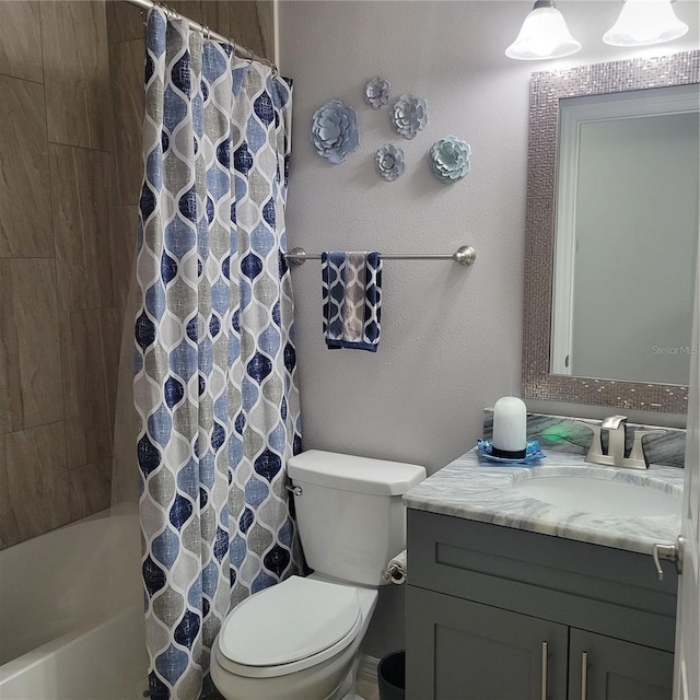 full bathroom with vanity, toilet, and shower / tub combo