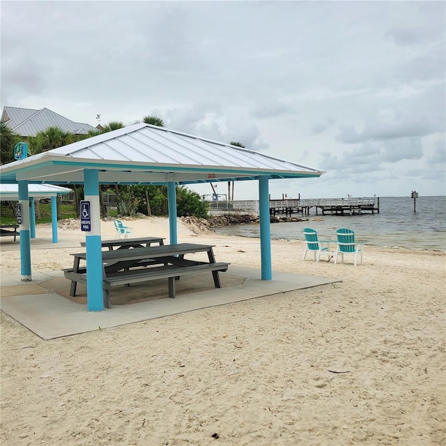 view of property's community with a gazebo and a water view