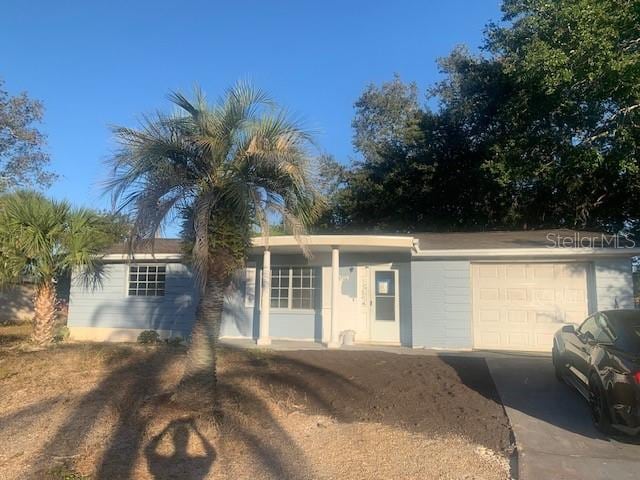 single story home with a garage