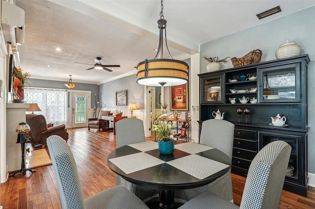 dining area featuring hardwood / wood-style flooring, ornamental molding, and ceiling fan