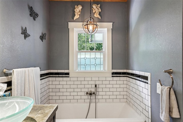 bathroom featuring vanity and a bathtub