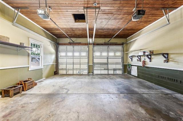 garage with a garage door opener and wooden ceiling