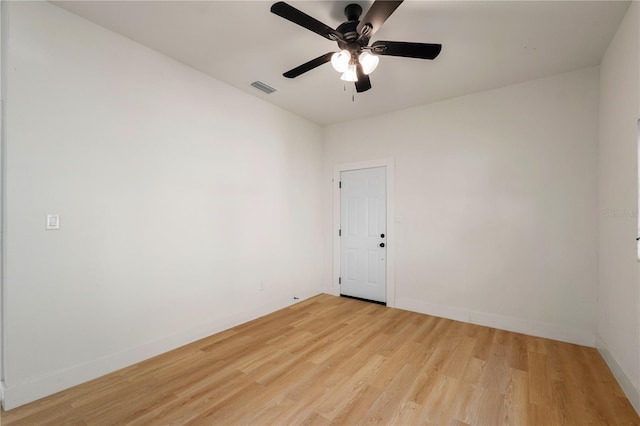 spare room featuring light hardwood / wood-style floors and ceiling fan